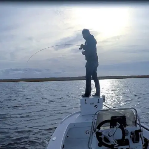 An angler fishing off a boat