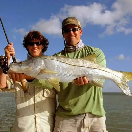 Mike Haines and a man holding a snook