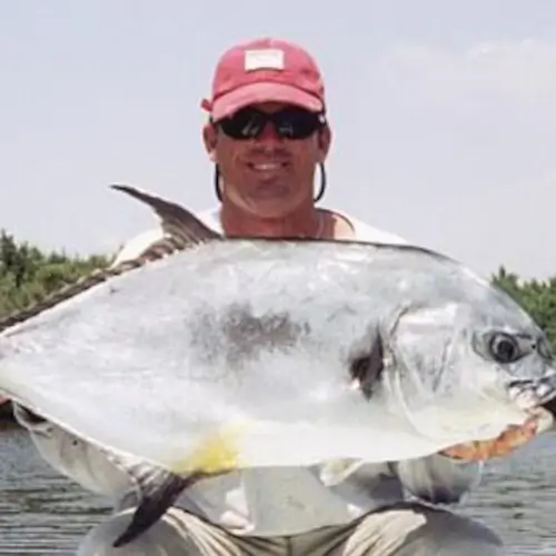 Mike Haines holding a permit fish