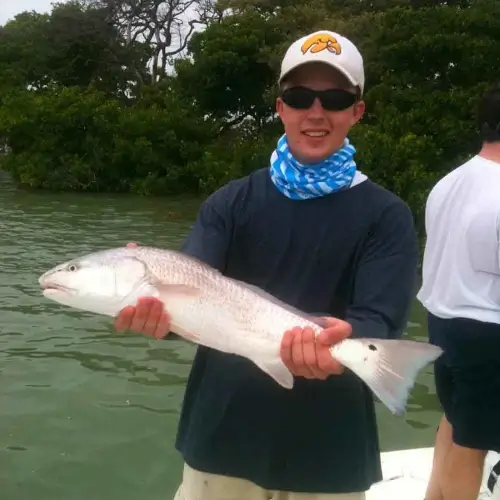 A man holding a redfish
