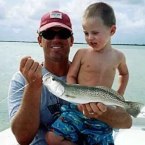 Mike Haines and kid holding a trout